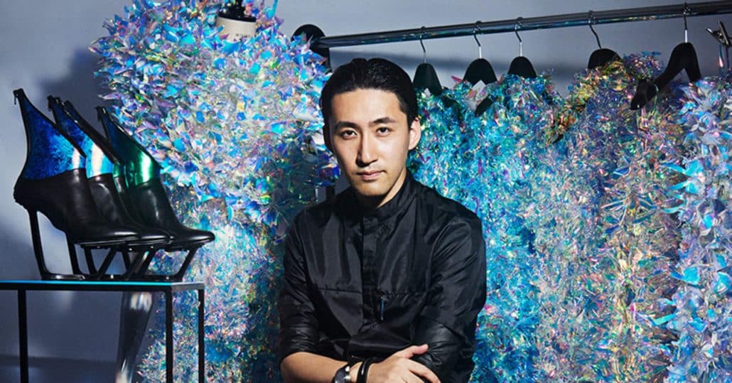 Yuima Nakazato in front of his AI designs