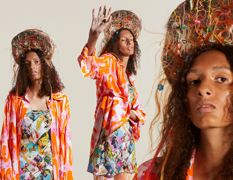 Model poses for Collina Strada's SS21 RTW collection in a psychedelic print shirt jacket